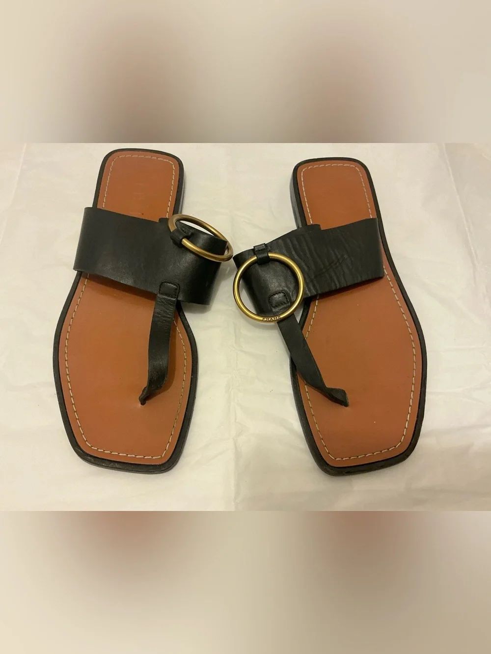 Frame Denim Black Leather Toe-Loop Sandals with Brown Footbed and Gold Rings